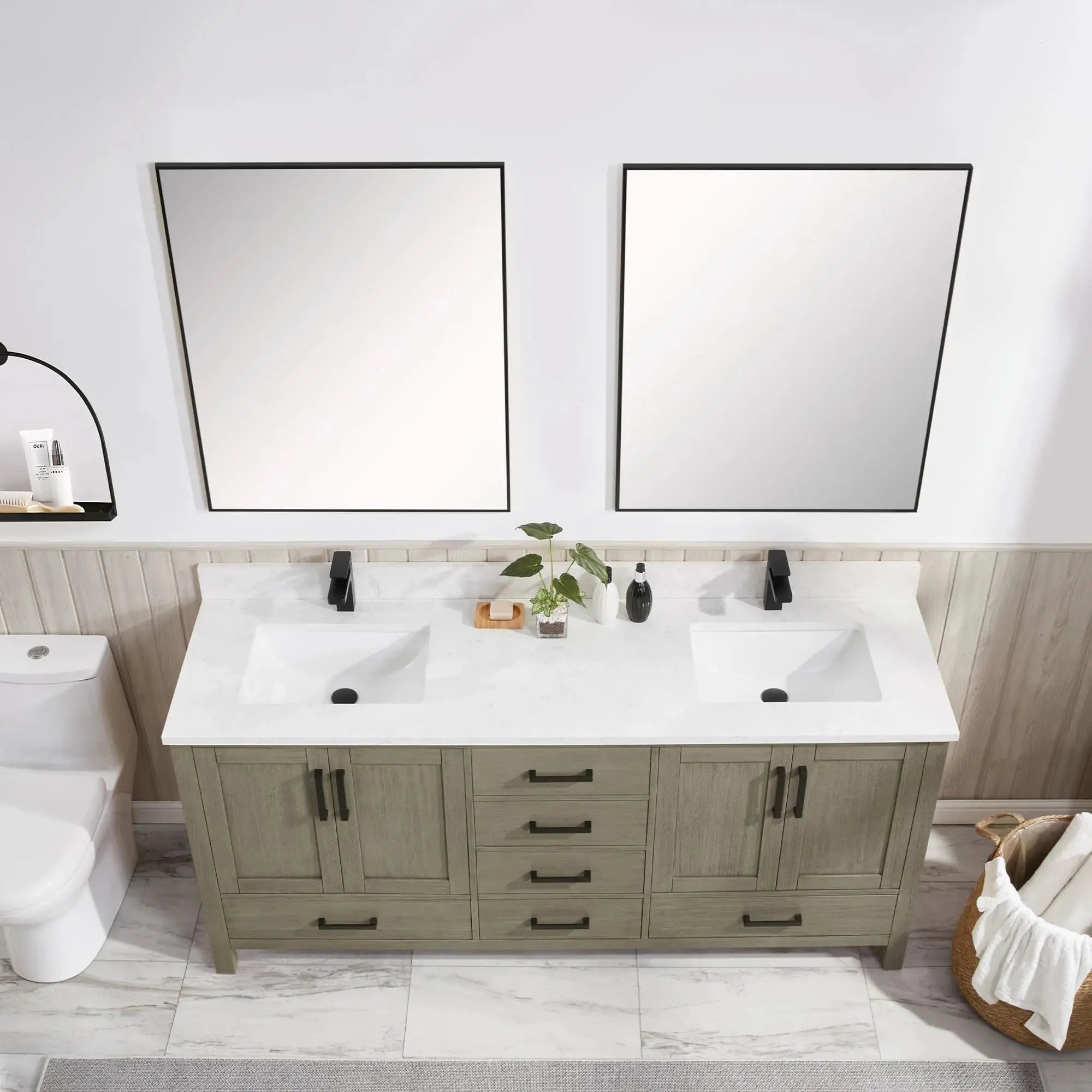 Bathroom vanity with double sink, mirrors, and wooden cabinets.