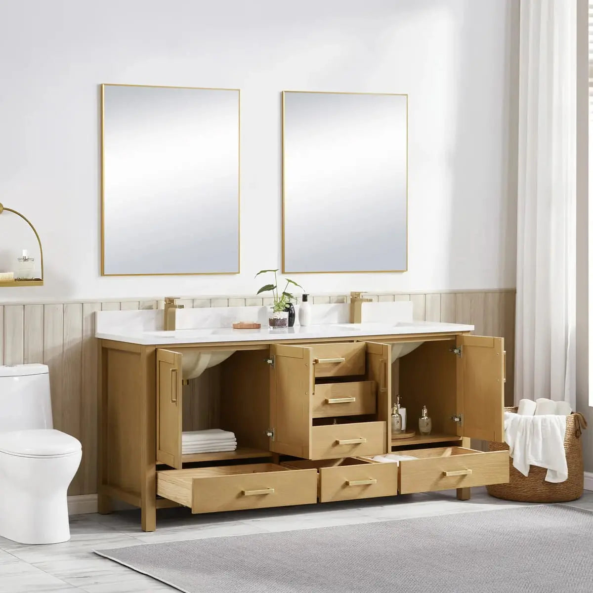 Bathroom vanity with open cabinet doors, two mirrors, and a toilet.
