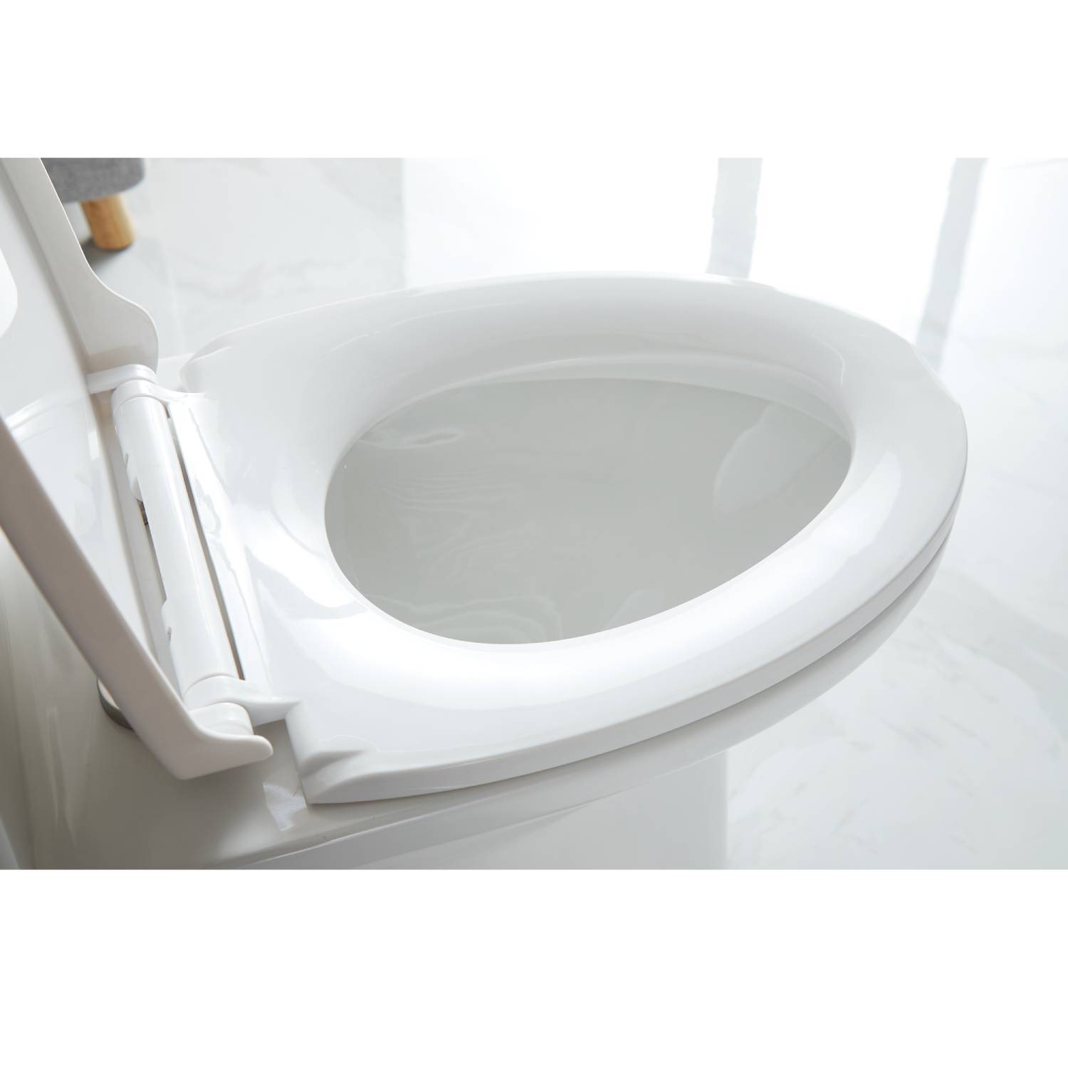 A traditional toilet installation in a classic bathroom lavatory, featuring a porcelain design with a modern touch for comfort and durability