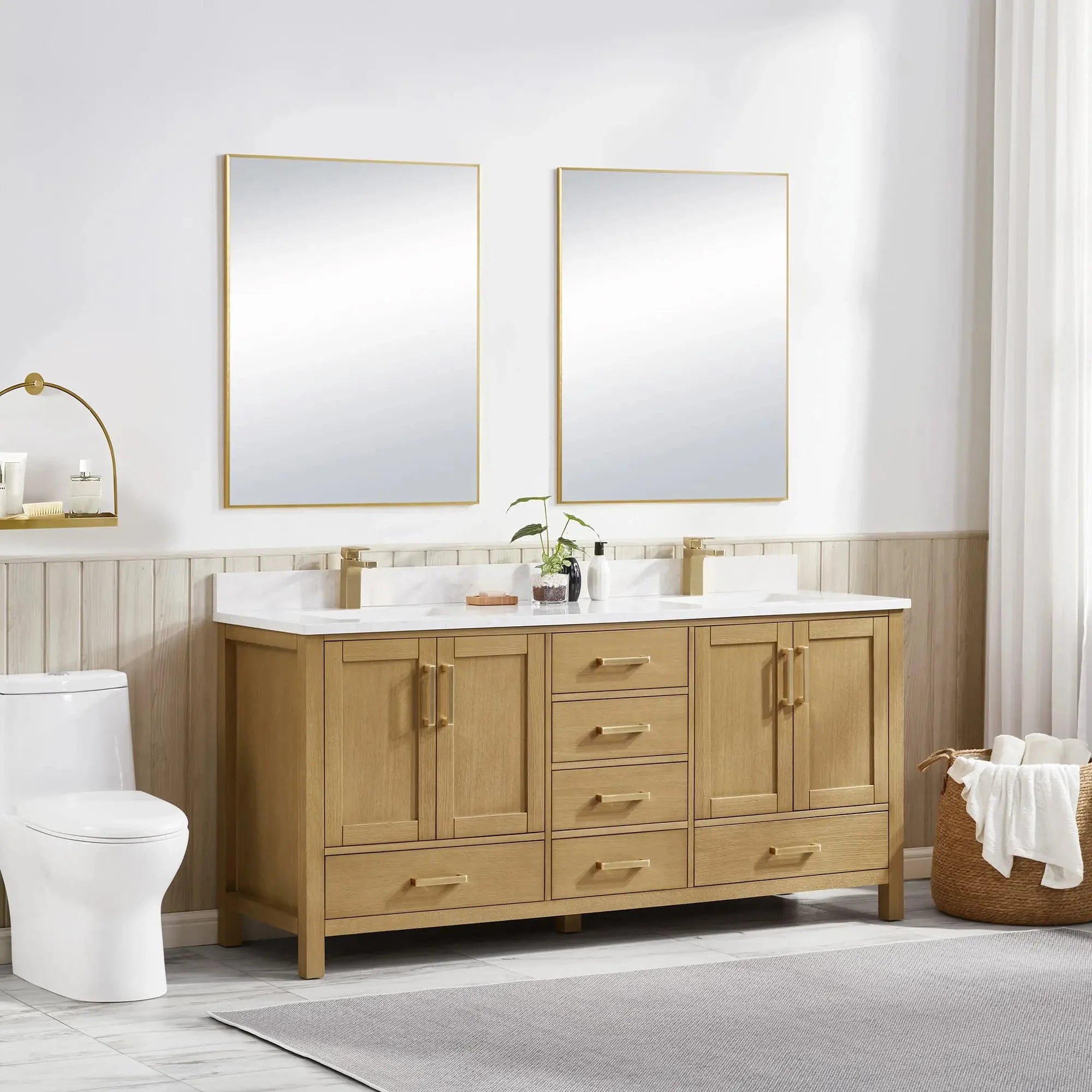 Bathroom with wooden vanity, white countertop, and two mirrors.