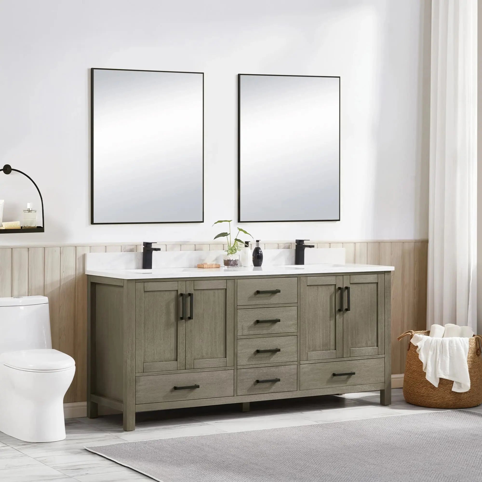 Bathroom with wooden vanity, mirrors, and a toilet.
